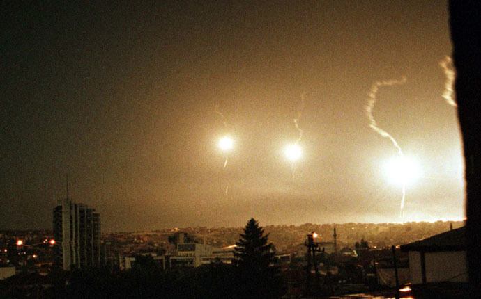 Flares illuminate the sky over Pristina during a NATO air strike early June 2, 1999 (Reuters/Goran Tomasevic)
