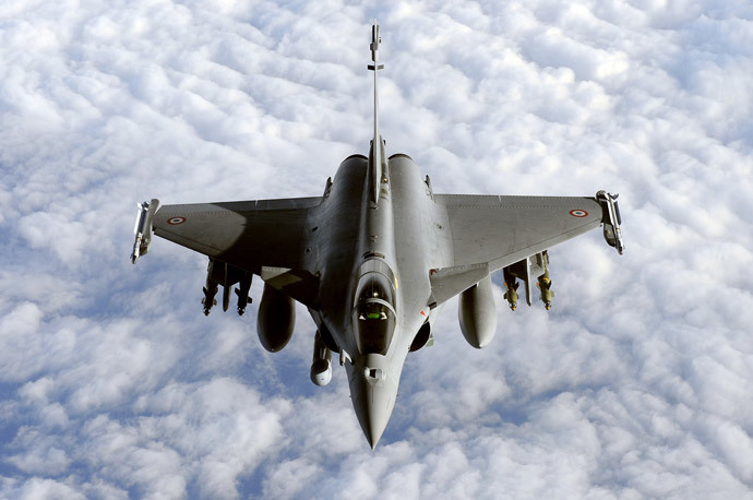 French Rafale fighter jet from the Istres military air base approaching an airborne Boeing C-135 refuelling tanker aircraft (not pictured) during a refuelling operation above the Mediterranean sea as part of military actions over Libya. (AFP Photo / Gerard Julien)