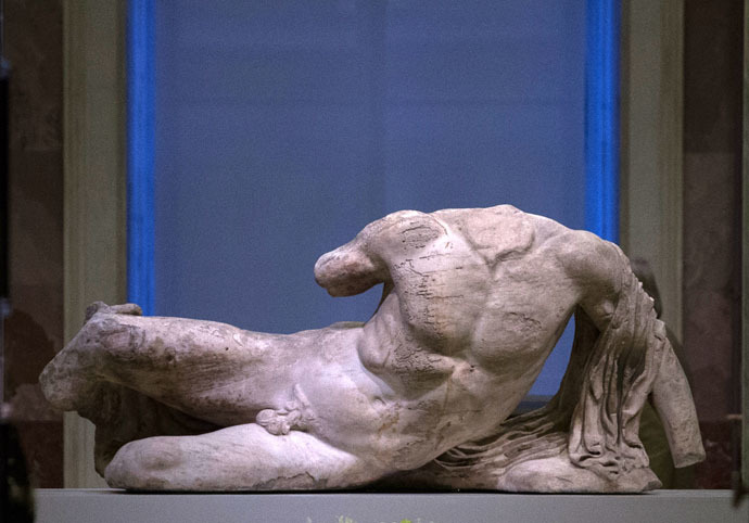The marble sculpture of the river god Ilissos, part of the famous Elgin Marbles, which decorated the facade of Greece's Parthenon temple, at an exhibition in Hermitage State Museum. (RIA Novosti/Igor Russak)