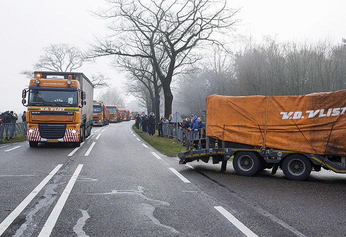 Trucks carrying wreckage from Malaysia Airlines flight MH17 arrive at a Dutch airforce base in the southern town of Gilze-Rijen December 9, 2014. (Reuters/Michael Kooren)