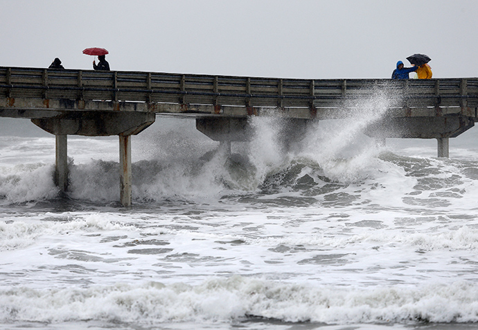 High waves crash under the Ocean Beach Pier as a winter storm brings rain and high winds to San Diego, California December 12, 2014 (Reuters / Mike Blake)