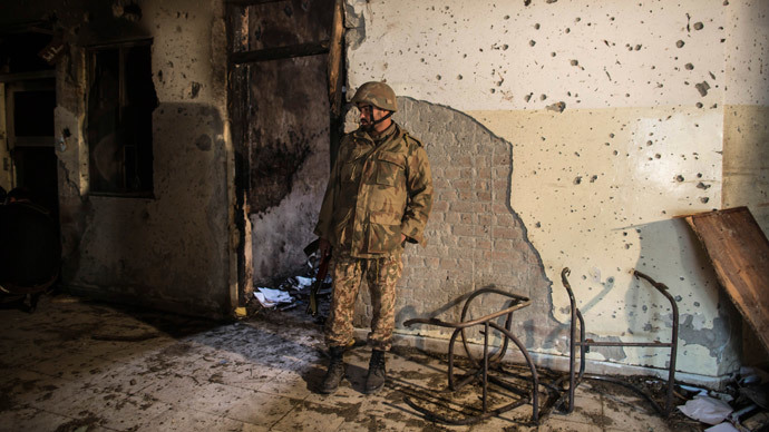 An army soldier inspects the Army Public School, which was attacked by Taliban gunmen, in Peshawar, December 17, 2014. (Reuters / Zohra Bensemra)