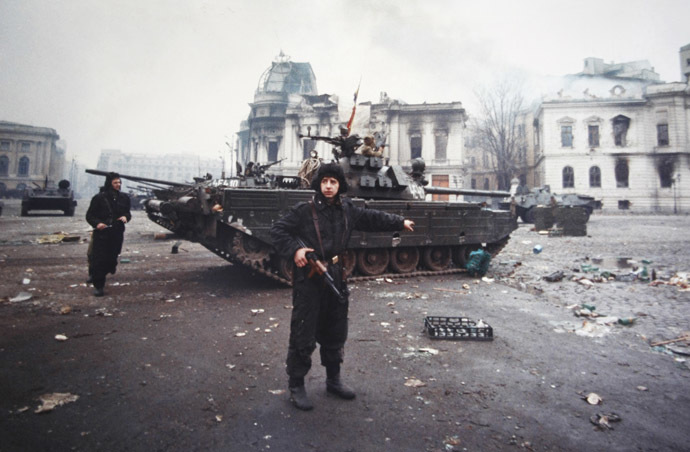 A soldier gestures after an exchange of fire between the army backed up by armed civilians and pro-Ceausescu supporters in Bucharest December 24, 1989. (Reuters/Eric Gaillard)