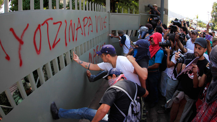‘Here are the murderers’: Mexico protesters storm & graffiti military base