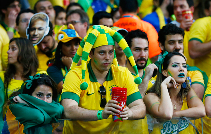 Fans of Brazil react during their 2014 World Cup semi-finals against Germany at the Mineirao stadium in Belo Horizonte July 8, 2014. (Reuters / Eddie Keogh)