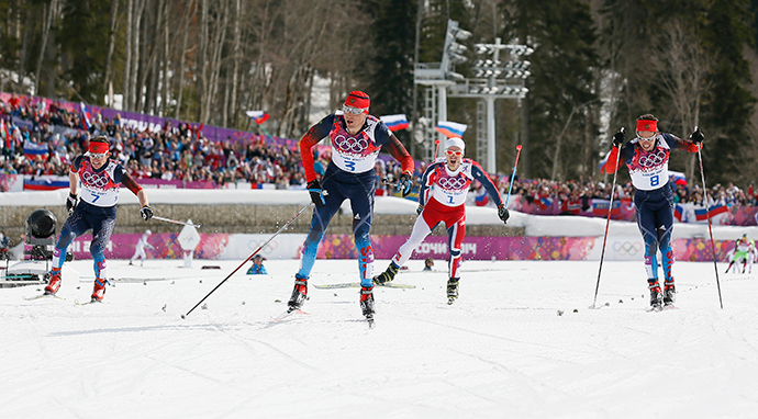 Russia's Alexander Legkov (C) approaches the finish line ahead of his compatriots Maxim Vylegzhanin (L) and Ilia Chernousov (R) and Norway's Martin Johnsrud Sundby during the men's cross-country 50 km mass start free event at the Sochi 2014 Winter Olympic Games in Rosa Khutor February 23, 2014. (Reuters / Stefan Wermuth)