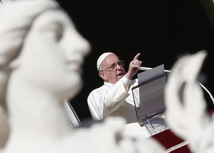 Pope Francis gestures as he leads the Angelus prayer in Saint Peter's Square at the Vatican January 1, 2015. (Reuters/Alessandro Bianchi)
