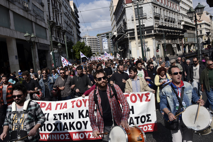 Communist affiliated protesters march in central Athens during a massive protest rally against unemployment and the austerity measures on October 4, 2014, as the country undergoes a new audit of its finance by the EU, IMF and the European Central Bank. (AFP Photo / Louisa Gouliamaki)