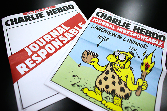 A picture taken on September 25, 2012 in Paris shows today's two editions of French satirical magazine "Charlie Hebdo" one reading "Irresponsible newspaper" (R) and the other, bearing an empty front page reading "responsible newspaper" (AFP Photo)