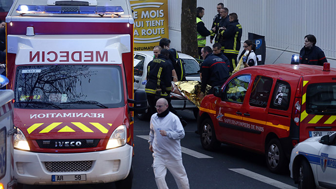 Police officer shot dead outside Paris, suspect at large – police