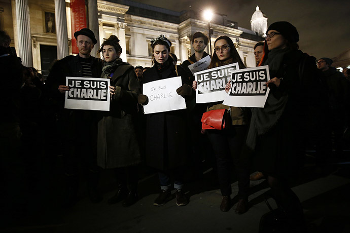 People attend a vigil at Trafalgar Square in London to pay tribute to the victims of a shooting in Paris. (Reuters/Stefan Wermuth)