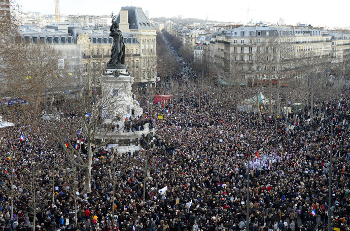 People gather on the Place de la Republique (Republic Square) in Paris before the start of a Unity rally âMarche Republicaineâ on January 11, 2015 in tribute to the 17 victims of a three-day killing spree by homegrown Islamists. (AFP Photo / Bertrand Guay)