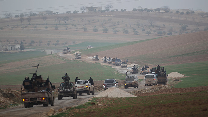 Members of al Qaeda's Nusra Front drive in a convoy as they tour villages, which they said they have seized control of from Syrian rebel factions, in the southern countryside of Idlib. (Reuters/Khalil Ashawi)