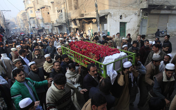 People carry the coffin of a male student who was killed in Tuesday's attack on the Army Public School, which was attacked by Taliban gunmen, during his funeral in Peshawar, December 17, 2014. (Reuters/Fayaz Aziz)