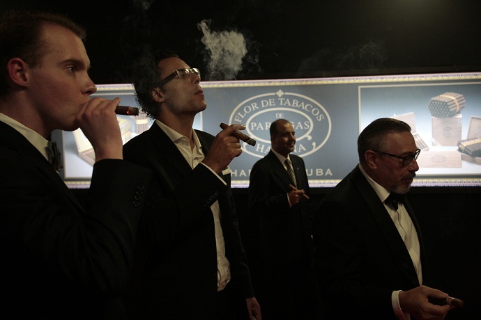 Cigar enthusiasts smoke smoke Cuban cigars (Reuters/Stringer)