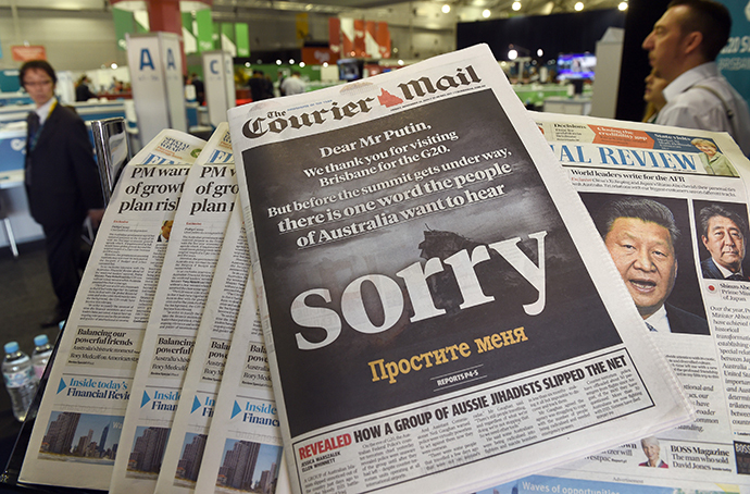 The front page of the local newspaper calls on Russia's President Vladimir Putin to apologize before the G20 Leader's Summit in Brisbane gets underway on November 14, 2014. (AFP Photo / William West)
