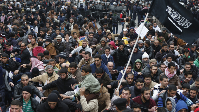 Protesters from the Islamic Action Front and others run to escape security forces after they tried to reach the French embassy during a protest against satirical French weekly newspaper Charlie Hebdo, which featured a cartoon of the Prophet Mohammad as the cover of its first edition since an attack by Islamist gunmen, after the Friday prayer in Amman January 16, 2015. (Reuters / Muhammad Hamed)
