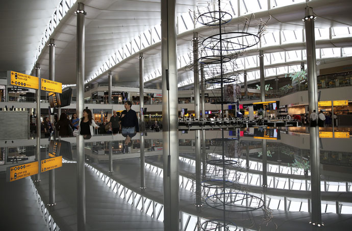 A view of the departure lounge is reflected in Terminal 2 at Heathrow Airport in London (Reuters/Neil Hall)