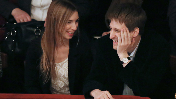 Former U.S. spy agency contractor Edward Snowden and his girlfriend Lindsay Mills in one of Moscow's theaters. (RIA Novosti/Anatoly Kucherena)