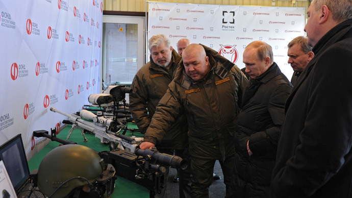 President Vladimir Putin (center) visiting the research institute of precision mechanics in Klimovsk, the Moscow suburbs, January 20, 2015. Second left: Dmitry Semizorov, Director-General, Research Institute of Precision Mechanics.(RIA Novosti / Michael Klimentyev)