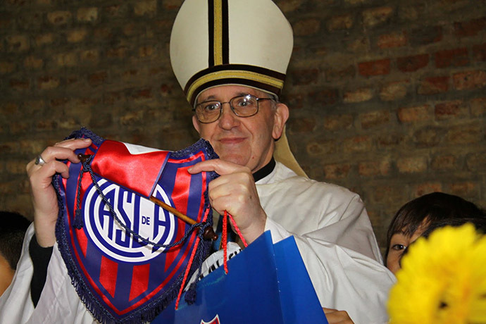 Argentine Cardinal Jorge Bergoglio poses with a jersey from the San Lorenzo soccer club, of which he is known to be a fan, in this undated handout photograph distributed by the club on March 13, 2013. (Reuters/San Lorenzo soccer club/Handout)