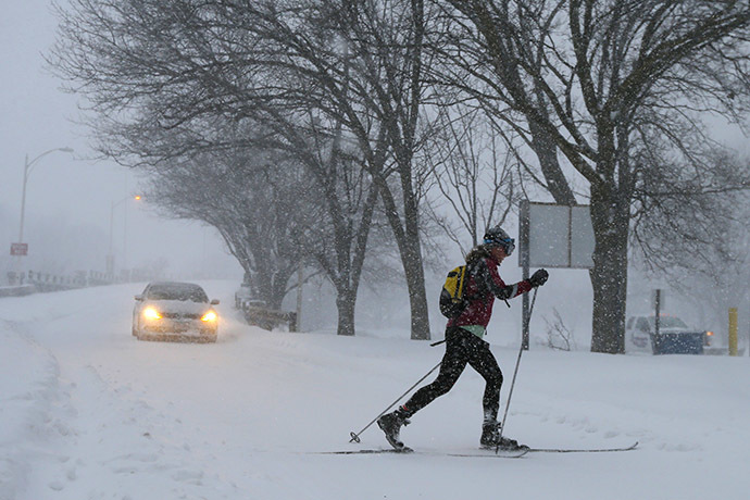 A woman cross country skis on snow covered roads during a blizzard in Boston, Massachusetts January 27, 2015. (Reuters/Brian Snyder)