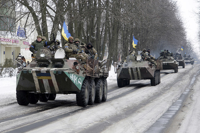 Members of the Ukrainian armed forces drive armored vehicles in the town of Volnovakha, eastern Ukraine, January 18, 2015. (Reuters/Alexander Ermochenko)