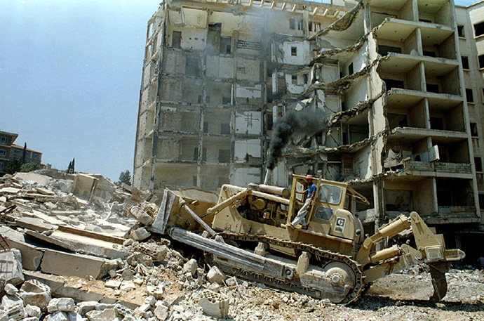FILE PHOTO: A bulldozer demolishes the bombed out building of the American embassy in Beirut. (Reuters)