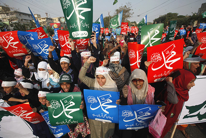 Supporters of Pakistan's political and religious party Jama'at e Islami chant slogans as they hold signs during a protest against satirical French weekly newspaper Charlie Hebdo, in Karachi January 25, 2015. (Reuters/Athar Hussain)