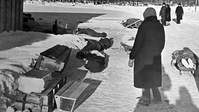 (ARCHIVE) A woman standing by corpses and coffins in besieged Leningrad. (RIA Novosti)
