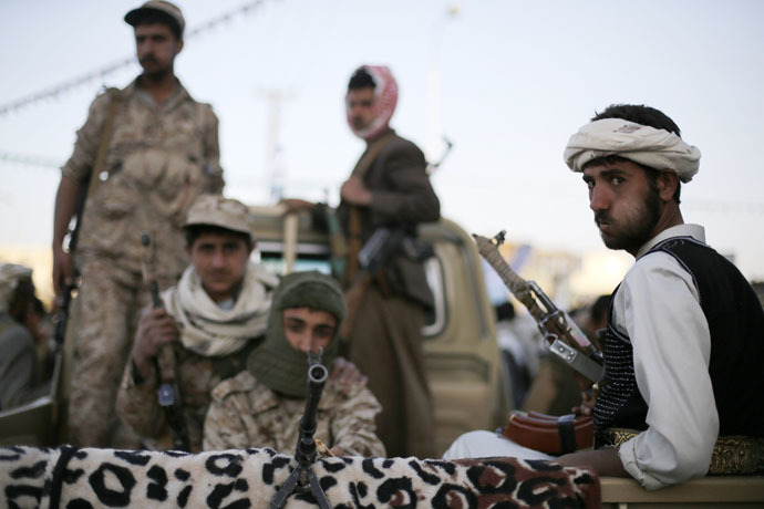 Houthi fighters patrol a road where followers ofthe Houthi movement are demonstrating to show support to the Houthi movement in Sanaa January 23, 2015. (Reuters/Khaled Abdullah)