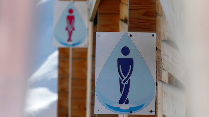 Confusing unisex toilet signs in Swedish library throw visitors off balance