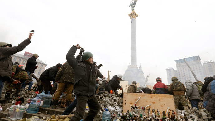 Anti-government protesters throw stones towards Interior Ministry members and riot police in Independence Square in central Kiev February 19, 2014.(Reuters / Vasily Fedosenko)