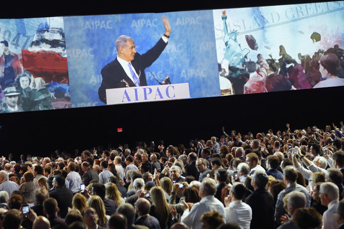 Israel's Prime Minister Benjamin Netanyahu is shown on a video screen as he waves at the end of his remarks to the American Israel Public Affairs Committee (AIPAC) policy conference in Washington, March 2, 2015. (Reuters/Jonathan Ernst)