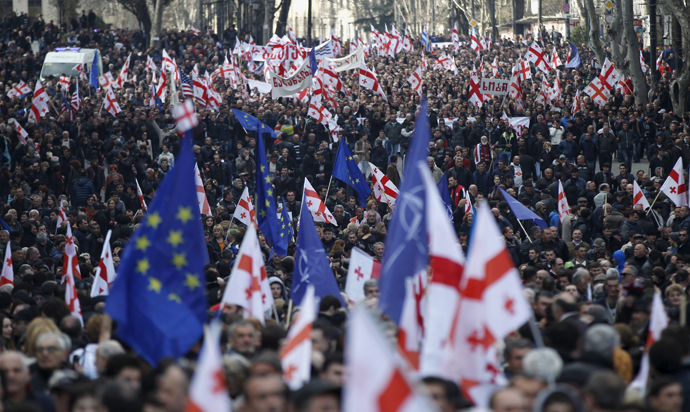 Opposition supporters march on the street during a rally organised by the United National Movement, calling for the resignation of the government in Tbilisi, March 21, 2015. (Reuters / David Mdzinarishvili)