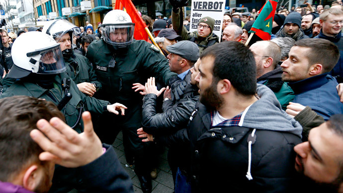 German riot police officers confront anti-Salafist protestors during a demonstration again extremist Muslim Salafists in Wuppertal March 14, 2015.(Reuters / Kai Pfaffenbach)