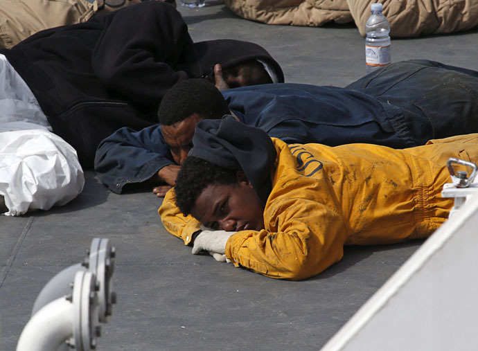 Surviving immigrants lie on the deck of the Italian coastguard ship Bruno Gregoretti in Senglea, in Valletta's Grand Harbour April 20, 2015. (Reuters/Darrin Zammit Lupi)
