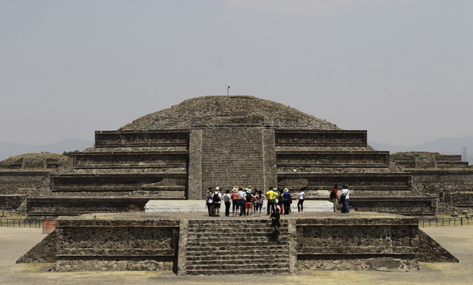 Visitors look on at the archaeological area of the Quetzalcoatl Temple near the Pyramid of the Sun at the Teotihuacan archaeological site, about 60 km (37 miles) north of Mexico City (Reuters / Henry Romero)