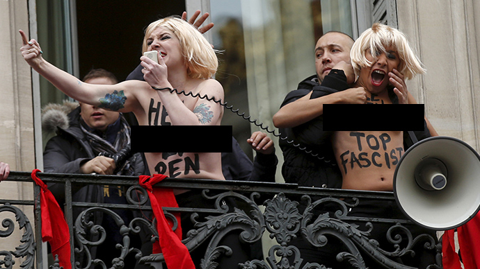 ‘Quite a paradox’: Topless FEMEN activists attack Marine Le Pen at May Day rally (VIDEO)