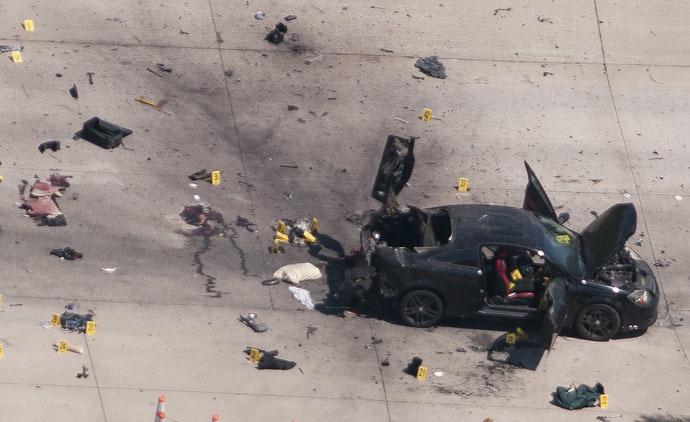 An aerial view shows the car that was used the previous night by two gunmen, who were killed by police, as it is investigated by local police and the FBI in Garland, Texas May 4, 2015. (Reuters/Rex Curry)