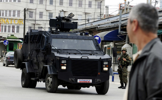 A Macedonian police armoured personnel carrier drives past premises in Kumanovo, north of the capital Skopje, Macedonia May 9, 2015.(Reuters / Ognen Teofilovski )