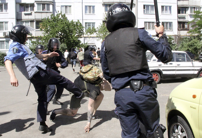 Interior Ministry members attack an anti-gay protester during the so-called Equality March, organized by a lesbian, gay, bisexual and transgender (LGBT) community, in Kiev, Ukraine, June 6, 2015. (Reuters / Maksym Kudymets)
