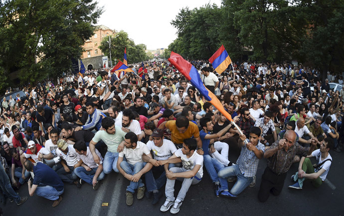 Protesters gather during a rally against a recent decision to raise public electricity prices in Yerevan, Armenia, June 23, 2015. (Reuters / Hayk Baghdasaryan)