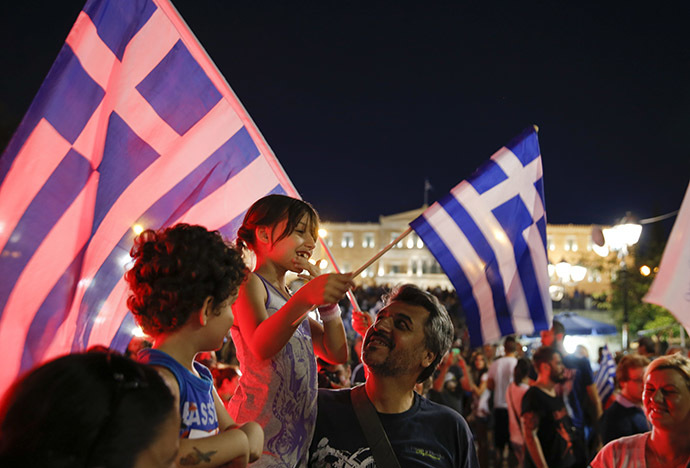 Anti-austerity 'No' voters celebrate the results of the first exit polls in front of the Greek parliament in Syntagma Square in Athens, Greece July 5, 2015. (Reuters / Marko Djurica)