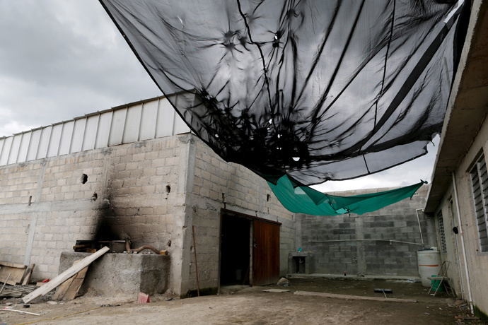 General view of the entrance of a warehouse where a tunnel, connected to the Altiplano Federal Penitentiary and used by drug lord Joaquin 'El Chapo' Guzman to escape, was located in Almoloya de Juarez, on the outskirts of Mexico City, July 12, 2015. (Reuters / Tomas Bravo)