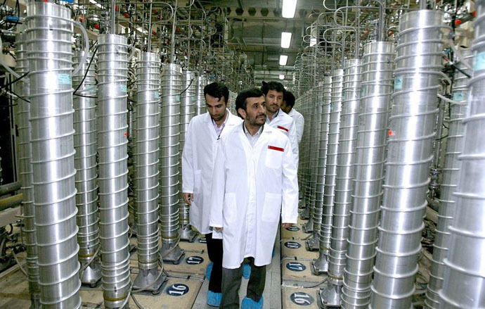 A handout picture released by Iranian President Mahmoud Ahmadinejad's official website shows him (R) listening to an expert during a tour of Tehran's research reactor centre on February 15, 2012 (AFP/President.ir)
