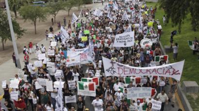 ‘Filthy, shameless robbery’: Thousands protest Mexico’s new tax regime