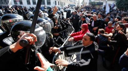 National strike, protests and clashes as Tunisia mourns for assassinated opposition leader 