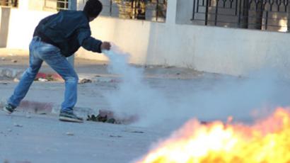 Police station trashed in Tunisia clashes as ruling Islamists reject dissolving government