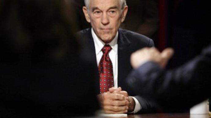 Ron Paul challenges Cain over Fed